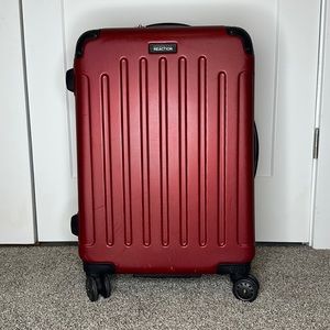Kenneth Cole Reaction luggage. Color red